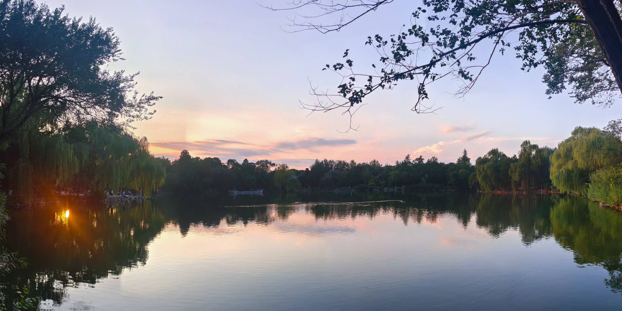 A long band of sunset reflected over calm water